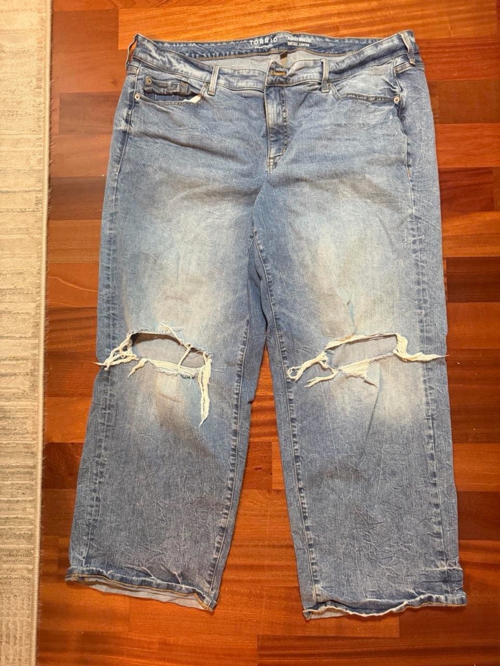 torrid light blue distressed boyfriend jeans with knee rips